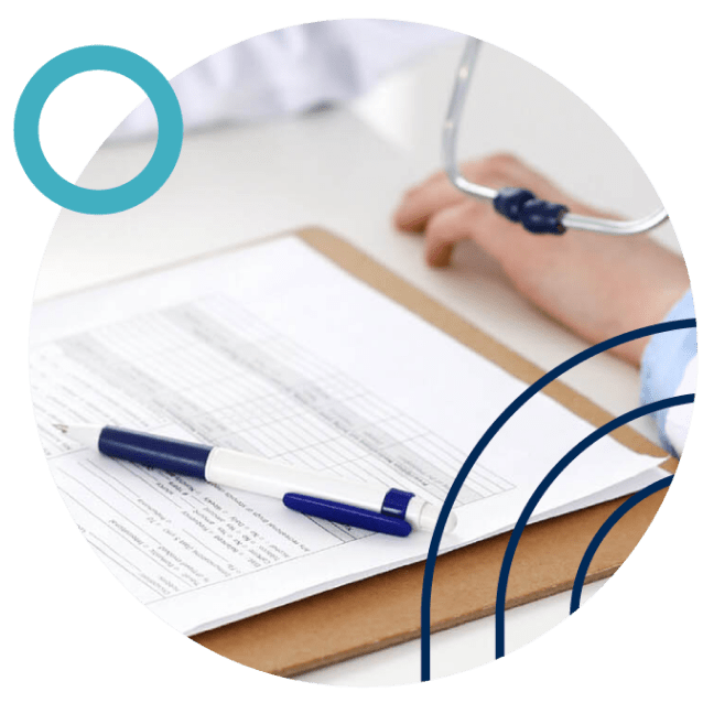 A person wearing a white coat is holding a stethoscope while filling out forms on a clipboard with a blue and white pen on top. Abstract blue circles decorate the image.